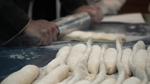 Hands Rolling Dough in Kitchen Stock Footage 317472620