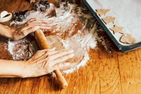 Hands rolling gingerbread dough Stock Photos