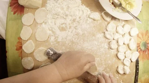 Hands With Rolling-Pin Unroll Paste on Board For Cooking Flour, Many Pieces of Stock Footage 66456727