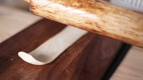 Hands rolls it with a rolling pin The process of cooking baking. Stock Footage 135887893