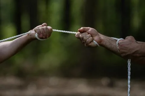 Hands rope trust concept shows reliability. Hands rope agreement concept shows Stock Photos