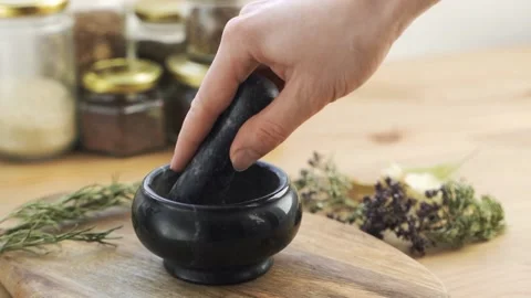 Hands Rubbed The Herbs in a Mortar Video stock 149751478