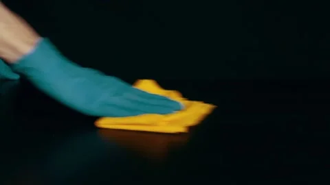 Hands in rubber gloves wipe the table from dust. Cleaning Stock Footage 105959964