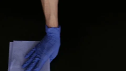 Hands in rubber gloves wipe the table from dust. Cleaning. Top view Stock Footage 105959983