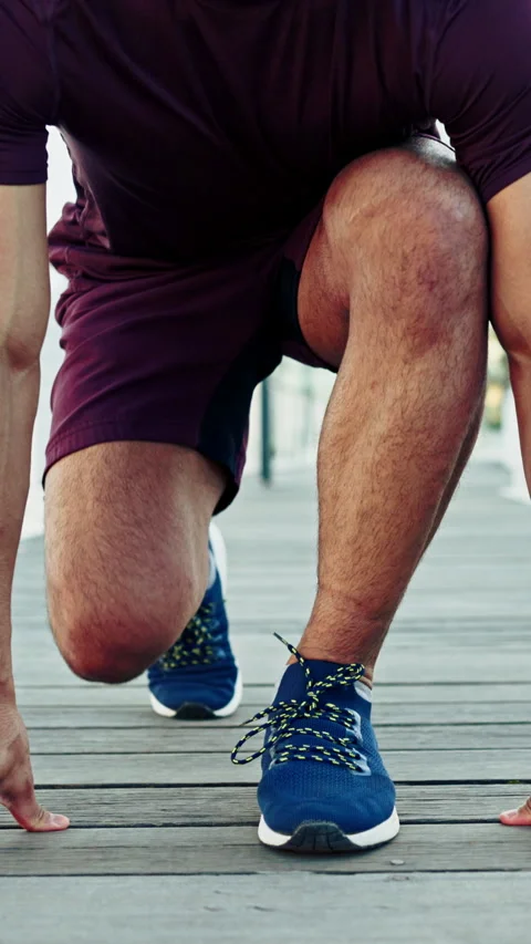 Hands, runner and tie with shoelace in city with fitness, start and posture for Stock Footage 334458605
