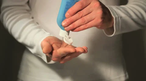 Hands sanitizing close up studio Видео 24786548