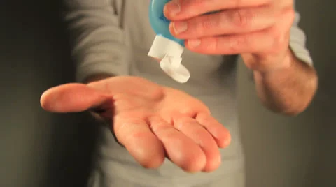 Hands sanitizing close up studio Stock Footage 24786763