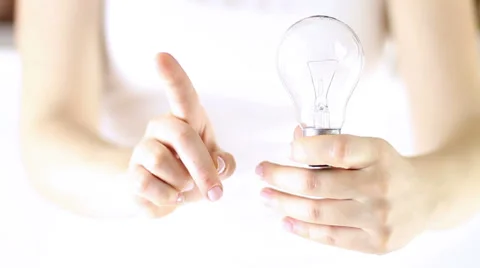 Hands saying using old bulbs type is wrong - Ecology and Economy concept Stock Footage 34866392