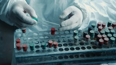 Hands of a scientist doing analyzes. Scientific laboratory test tubes Stock Footage 131341090