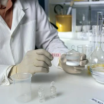 The hands of a scientist working with laboratory samples of nutritional suppl Stock Photos
