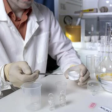 The hands of a scientist working with laboratory samples of nutritional suppl Stock Photos
