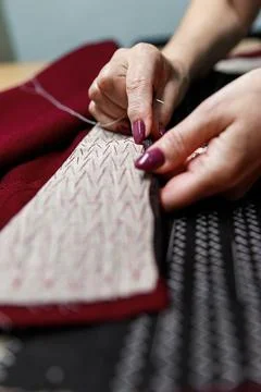 Hands with scissors on the fabric 스톡 사진