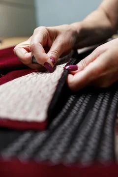 Hands with scissors on the fabric 스톡 사진