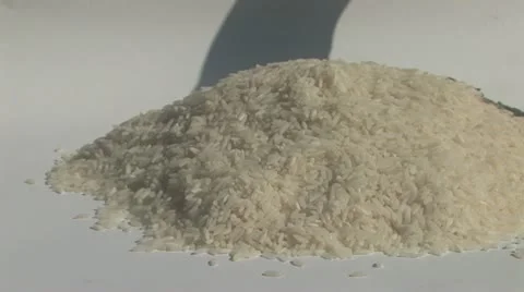 Hands scooping rice Stock Footage 11706773