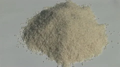 Hands scooping rice Stock Footage 11706903