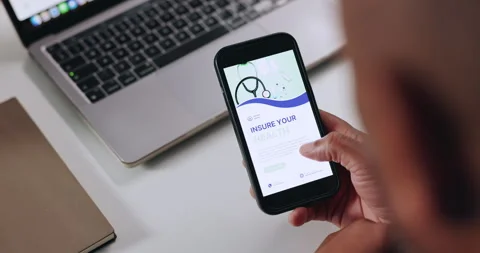 Hands, screen and man in office, smartphone and application for health insurance Stock Footage 312277891