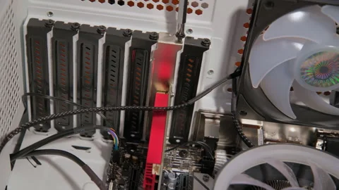 Hands with screwdriver assemble computer parts in PC. Close up Stock Footage 268308697
