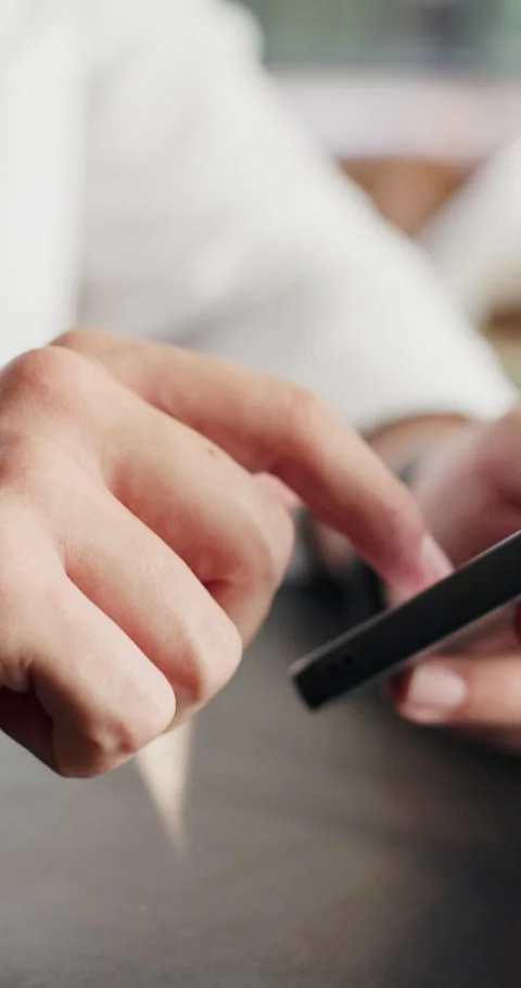 Hands, scroll and freelancer with smartphone, online and communication with Stock Footage 330923616