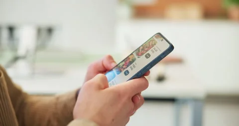 Hands, scroll and phone screen in business for food delivery, digital menu or 動画素材 318775148