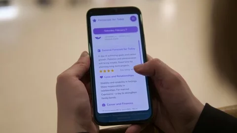 Hands scrolling horoscope app Stock-Footage 328567347