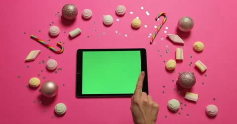 Hands scrolling, tapping pages on tablet with green screen. Chroma key Stock Footage 221490465