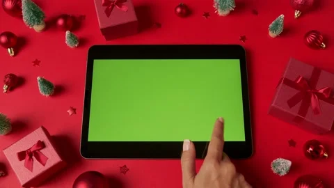 Hands scrolling, tapping, zooming pages on tablet with green screen. Chroma k Stock Footage 220951356