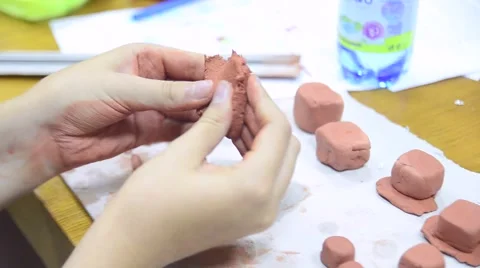 Hands sculpting with clay Stockbeeldmateriaal 60986269