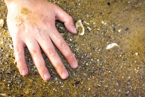 Hands on sea background closeup Stock Photos