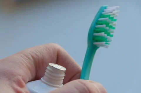 Hands sealed toothpaste and brush 写真素材