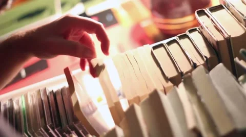 Hands searching books Stock Footage 47323398