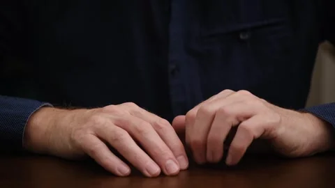 Hands seated man tap their fingers on table. obsessive gestures in expectation. Stock Footage 297914833