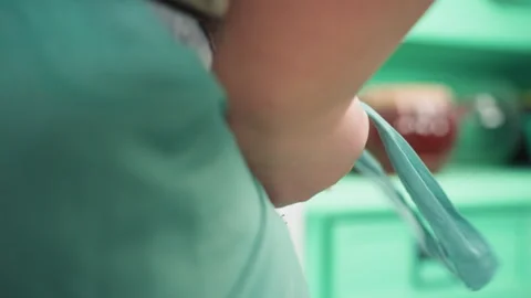 Hands secure apron. Individual tightening apron before starting ceramic project Stock Footage 337362279