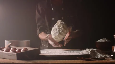 Hands of senior experienced chef kneading floured dough at bakery, old man Stock Footage 136809648