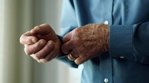 Hands of senior man getting dressed. Stock Footage 88374170