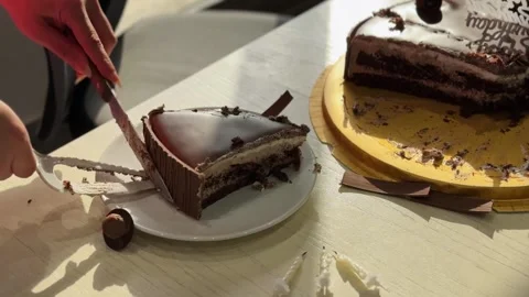 Hands Serving Chocolate Birthday Cake Slice On Plate Stock Footage 343006905