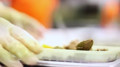 Hands serving food in the kitchen of a local feast Stock Footage 47211125