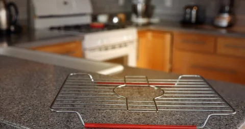 Hands set down a fresh, home-made peach pie with crumble-topping. Stock Footage 129067641