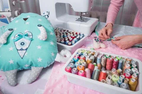 Hands sew clothes Stock Photos