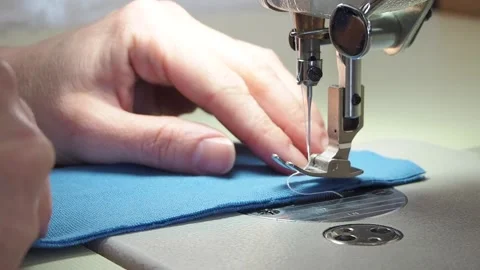 Hands sew on a sewing machine close-up Video stock 130827645