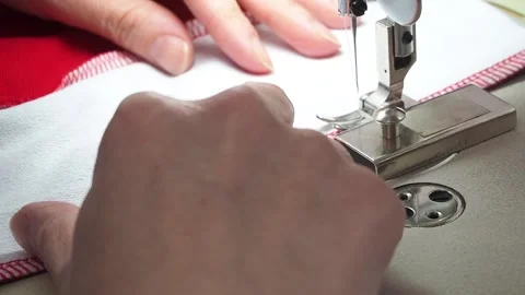 Hands sew on a sewing machine close-up Video stock 130828326