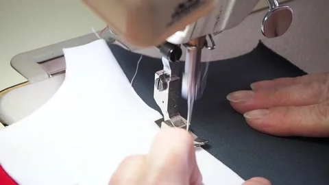Hands sew on a sewing machine close-up Video stock 130828338
