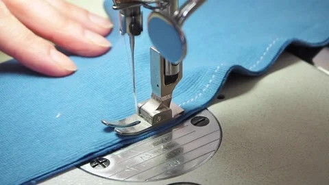 Hands sew on a sewing machine close-up Stock Footage 130828470