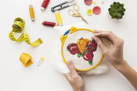 Hands sewing cute fruit design white background Stock Photos