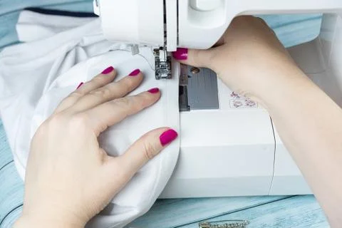 Hands on the sewing machine Stock Photos