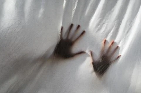 Hands shade behind sheet Stock Photos