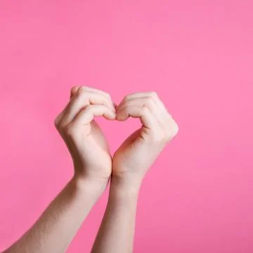 Hands in the shape of a heart Stock Photos