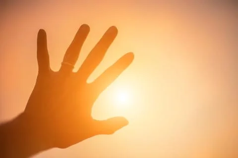 Hands-shape for the Sun. Stock Photos