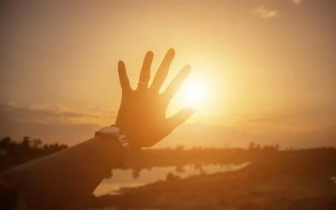 Hands-shape for the Sun. Stock Photos