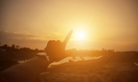 Hands-shape for the Sun. Stock Photos
