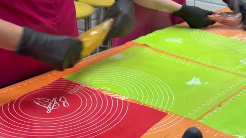 Hands Shaping Amber Candy Piece On Mat 스톡 동영상 342510871